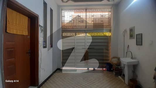 2.5 marla house with 4 rooms and attached bathrooms. Water and electricity available. Located in a good area near the main road, perfect for family living.