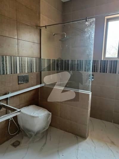 F-11 Brand New Ground Floor Excellent Proper Tiled Floor 700 SQY Proper 3 bedrooms 3 Attached Bathrooms Drawing Dining. TV lounge, Kitchen Beautiful Lawn, Parking 4 Cars, Servant Quarter