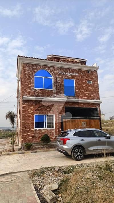 5 Marla Corner House Near Bahria Enclave Beautifully Located On Malot Road, 5 Spacious Bedrooms With Attached Bathrooms, 2 Modern Kitchens, And Mumty/Store Room On Rooftop. Situated On A 60 Ft Wide Road For Easy Access . Electricity Meter Installed & Water Boring Available.