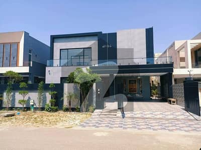 1 KANAL ELEGANT AND FULLY MAINTAINED SUPER HOT LOCATED MODERN BUNGALOW IS AVAILABLE IN THE BEST BLOCK OF DHA LAHORE