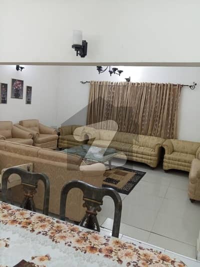DHA PHASE 2 500 YARDS 5 BEDROOMS TILE FLOORING BUNGALOW IS UP FOR URGENT SALE ON HEIGHTED LOCATION