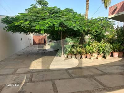 Opportunities to own an estate of this magnitude in the heart of DHA Phase 1 are exceptionally rare. Spanning a massive 2200 Square Yards, this grand, beautifully designed, and meticulously maintained bungalow