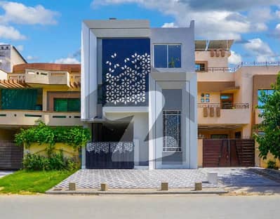 8 Marla Brand New Rooftop Pool Multiple Skylights Double Height Living Central courtyard. Luxury House for Sale in Johar Town Phase 2 on 65 Ft Road Near to Emporium Mall Hot Location