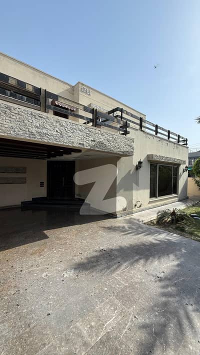 21 MARLA ELEGANT CORNER OLD BUNGALOW WITH BASEMENT AND BIG LAWN IS AVAILABLE IN THE BEST BLOCK OF DHA LAHORE.