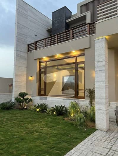 EXCLUSIVE LUXURY RESIDENCE FOR SALE   Phase 8 | Prestigious   1000 Sq. Yards | West Open Step into a world of elegance and sophistication with this almost brand-new, architecturally refined bungalow, designed for those who appreciate luxur