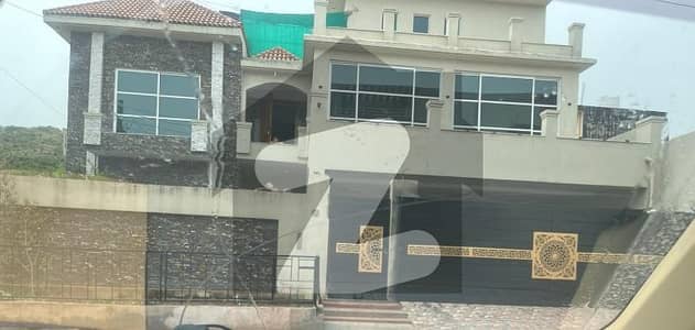 21 Marla new solid and 3 story house. front 54. beck 90ft. 8 bedrooms. with 2 kichens. 2 dringroom 2 lounge study room. big car parking space with lown. opp Musjid Qudsia. 2.5 km from imran khan chowk Banigala Islamabad