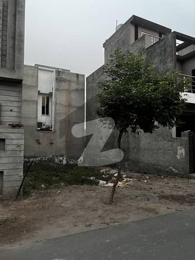 3.7 Mrla Plot  Very Near To Park 3 Side Covered  Road Level Plot