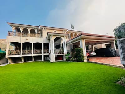 2 Kanal Slightly Used Spanish Design Most Beautiful 9-Bedroom Full Basement Triple Unit Facing Park Bungalow For Sale at Prime Location of DHA Lahore Near To Park Masjid & Commercial Market .