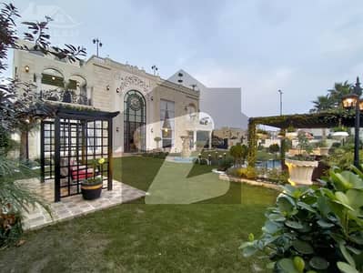 KANAL BUNGLAW KANAL LAWN FULL BASEMENT FULLY FURNISHED PLUS SWIMMING POOL HOME CENIMA LIFT AND MANY OTHER AMENITIES BANGALOW FOR SALE NEAR TO MCDONALDS.