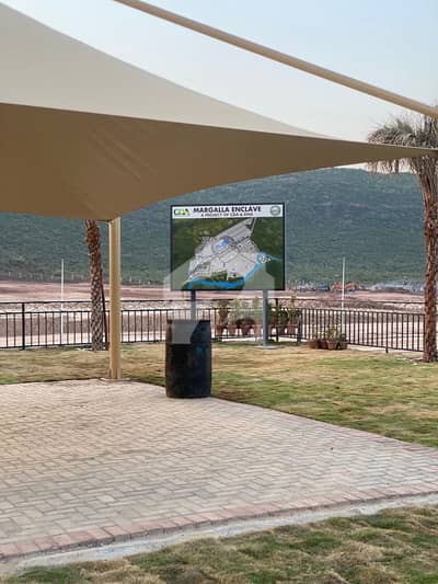 Prime Plot In Margalla Enclave, Islamabad ME 1 10 Southern ByPass ,Corner, Back Open And Boulevard Category Plots Available 3-Year Easy Installment Plan Ideal Investment Opportunity Limited Time Offer