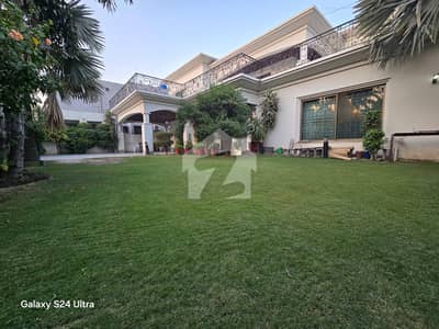 2 Kanal Slightly Used Spanish Design Well Maintained 8-Bedroom Full Basement Bungalow For Sale at Prime Location of DHA Lahore Near To Park Masjid & Commercial Market .