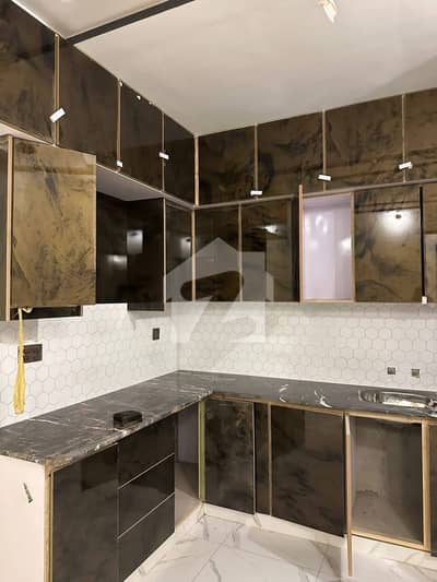 A brand new 120 square yard corner flat with rooftop in Saadi Town