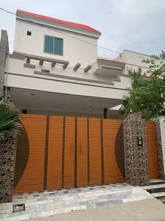12 Marla Residential Property Featuring Two Separate House Units With Separate Entrances.