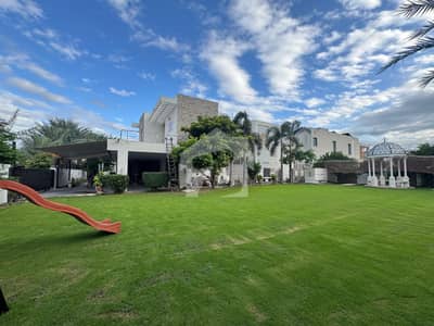 Corner 1 Kanal Lash Green Lawn + 2 Kanal Luxury Ultra-Modern Design Most Beautiful Full Basement Bungalow For Sale At Prime Location Of DHA Lahore Near To Park Masjid & Commercial Market.