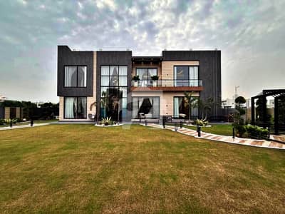 SYED BROTHERS PROUDLY OFFERS: 2-Kanal (1 K. Lawn and 1 K. Bungalow) Elegant And Fully Furnished Modern House with Basement, Swimming Pool, Theater Is Available In The Best Block Of DHA Lahore.