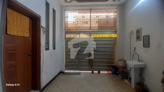 2.5 marla house with 4 rooms and attached bathrooms. Water and electricity available. Located in a good area near the main road, perfect for family living.
