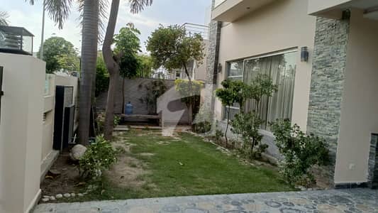 DHA Phase 5 1 Kanal Brand New House for Rent Beautifully designed modern house featuring elegant architecture, spacious bedrooms, stylish TV lounges, and premium finishing.