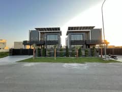 100% ORIGINAL PICTURE AND PRICE GIFT FOR TWO BROTHER 1-1 KANAL PAIR 2 HOUSES ELEGANT AND BRAND NEW SUPER HOT LOCATED HOUSE IS AVAILABLE IN THE BEST BLOCK OF DHA LAHORE.