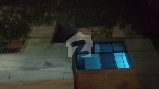 A solid 200-yard house on Ghazali Road, PECHS Block 2, Karachi. It offers 6 bedrooms with attached baths, 2 drawing rooms, 2 kitchens, and 2 floors. The house includes 4 additional washrooms, a west-open layout, a balcony, and great natural lightwindy and airy throughout the day. Theres a washing area on the ground floor, along with a rooftop that features a room and a washroom. A practical, spacious setup in a prime location.
