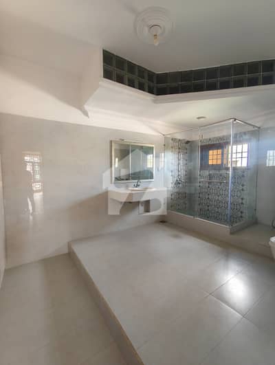 1000 Square Yard Elegant House with Huge Open Lawn in a Prime Location