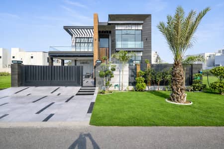 Magnificent One Kanal Contemporary Designer Bungalow Featuring Sophisticated Architecture, Luxurious Interior Finishes, A Prime Location Just Steps Away From Carrefour Market.
