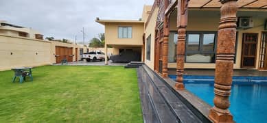 Experience Premium Living In This Stunning 1000 Square Yards Fully Furnished House With Pool & Basement Five Bedroom