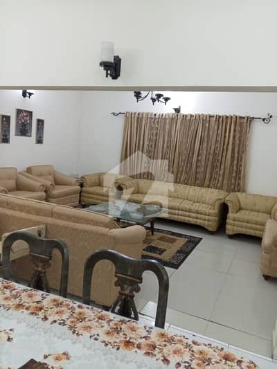 DHA PHASE 2 500 YARDS 5 BEDROOMS TILE FLOORING BUNGALOW IS UP FOR URGENT SALE ON HEIGHTED LOCATION