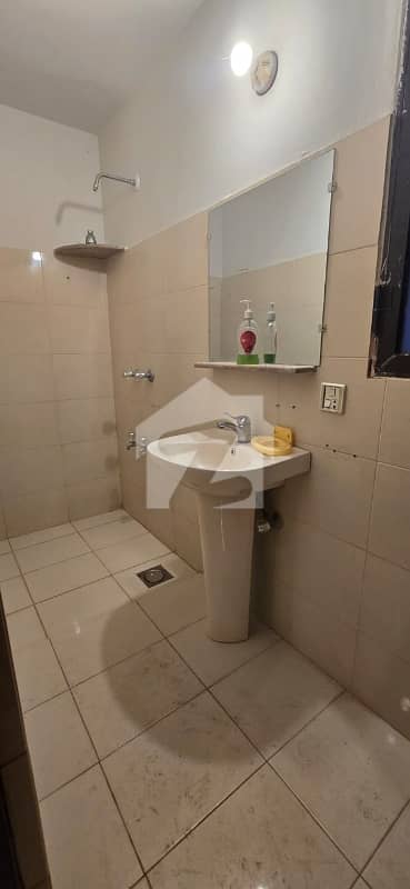 PRESTIGIOUS URBAN RETREAT: COMPACT & WELL-MAINTAINED 1000 SQ YD BUNGALOW WITH MASSIVE LAWN FOR RENT IN DHA