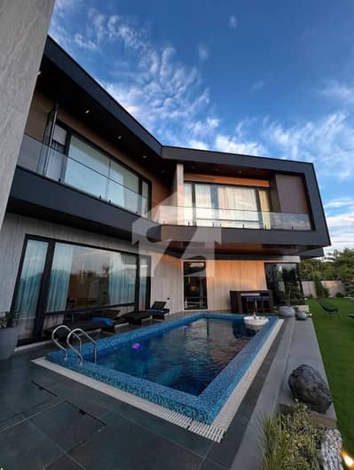 SYED BROTHERS PROUDLY OFFERS: 1-Kanal Elegant Bungalow with Cinema & Pool Is Available In The Best Block Of DHA Lahore.