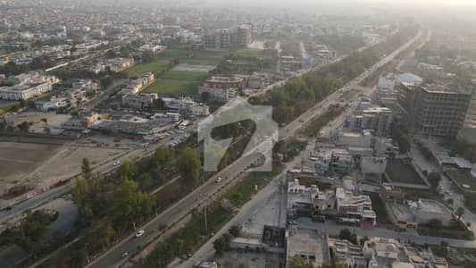 Corner 85 Marla Commercial Plot For Sale On Canal Road Faisalabad Best for Investment