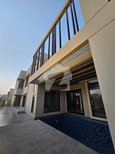 1000 sq yard brand new bungalow 2+5 Bedroom with basemnet swimming out class bungalow top of the line location also much more option available
