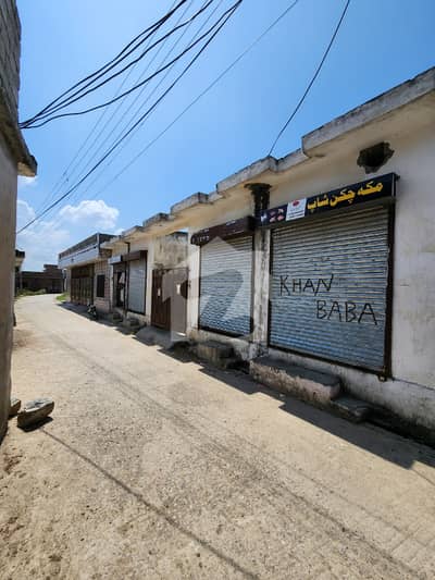 11 Marla Plot With 4 Shops Available For Sale On Gated Road Basti Wah Cantt