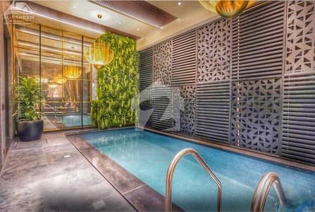 1 KANAL SLIGHTLY USED JUST LIKE BRAND NEW ULTRA MODERN FULLY FURNISHED BUNGALOW WITH OUTDOOR SWIMMING POOL FOR SALE IN DHA PHASE 6 NEAR TO RAYA.