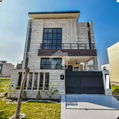 A beautifully designed and impeccably maintained 5 Marla luxury house is available in a prime DHA location, offering the perfect blend of elegance, comfort, and modern living.