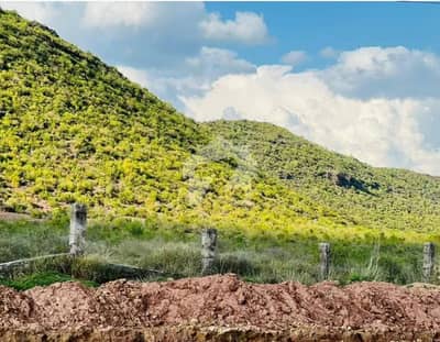 A prime 5 Marla plot is available for sale at a stunning location in Margalla Enclave Islamabad, offering a great opportunity for both investors and end-users