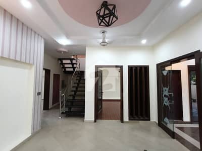 Elevate Your Lifestyle with This Stunning 10-Marla House for Rent in DHA Phase 6 Featuring Smart Layout Design, Luxury Finishes, 4 Spacious Bedrooms, Lush Green Lawn & Premium Family Living by Wall Green Realtors