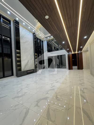 BEAUTIFUL BARAND NEW LUXURIOUS HOUSE TOP LOCATION EXCELLENT WASHROOMS MODREN FETING AND FIXTURES SWIMMING POOL GREEN LAWN