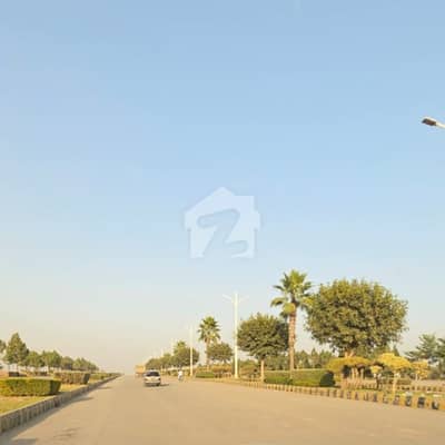 Prime Location Kanal Plot With 7 Marla Extra Land 2 Side Open Near Main Entrance And Boulevard Opposite Giga Mall In Aghosh 2 Housing Society Islamabad. .
