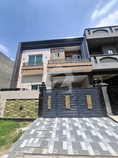 Beautiful and well-maintained 5 Marla house available for sale in a prime location. The house includes 5 spacious bedrooms with attached bathrooms, modern kitchen, TV lounge, drawing room, and car porch. Located in a peaceful and secure area with easy access to market, school, mosque, and main road. Ideal for families looking for a comfortable and convenient lifestyle.   Location: [Canal Garden]  Demand: [24500000]  Contact: [03024126994]