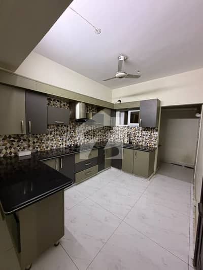 3 BED ELITE FLAT IN A ELITE BUILDING ON A ELITE LOCATION IN HEART OF BAHADURABAD SHAHED E MILAT ROAD