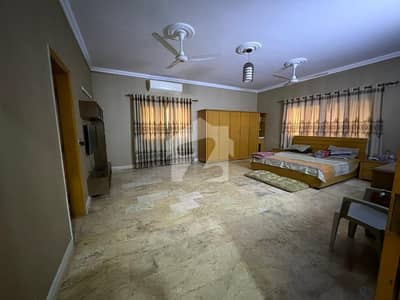 Bungalow for Rent DHA Phase 7 500Yds 5 Bedrooms Drawing Dinning with Powder Room  Marble Flooring Big Terrace 2 Kitchens Servant Quarter Guard Room Big Lawn 3 Parking Demand