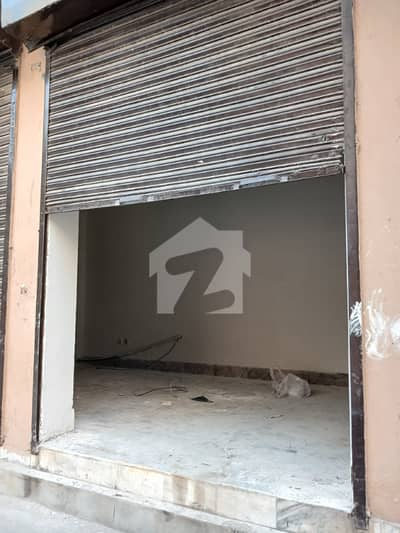 1.5 MARLA CORNER SHOP AVAILABLE FOR RENT AT A HOT LOCATION IN HIGHCOURT SOCIETY NEAR UMT UNIVERSITY 2 MINT WALK 3 SHUTTERS IN A SHOP ALL FACILITIES AVAILABLE