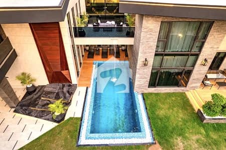 INVESTOR PRIZE 2 KANAL GALLERIA DESIGN CORNER ULTRA MODERN FULLY FURNISHED BUNGALOW WITH OUTDOOR SWIMMING POOL,ROOFTOP,LIFT PLUS 15 KVA SOLAR INSTALLED FOR SALE IN DHA PHASE 8.