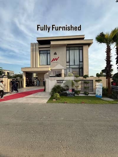 SYED BROTHERS PROUDLY OFFERS: 1-Kanal Elegant And Fully Furnished Modern Bungalow on Main Road In The Best Block Of DHA Lahore.