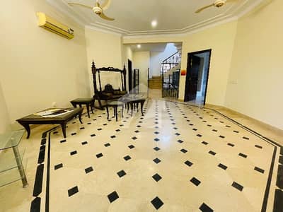Offering A Semi Furnished House In G-6 With Beautiful Lawn.