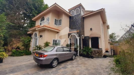 1.8 Kanal Luxury House for Sale | DHA Phase 1 Sector F, Islamabad | Scenic Forest View
