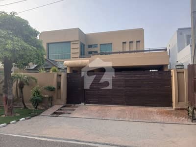 On 70-Feet Road 1 Kanal Top Location Double Unit Bungalow Is Available For Sale In The Best Block Of DHA Lahore. 100% Orignal Pictures.