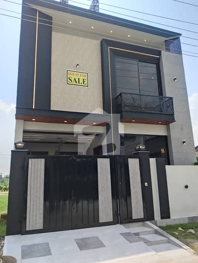 5 Marla double story house fr sale brand new home ideal and hot loction carpet road water electricity available 3D ultra model design Spanish look furnished home with wood work gated society 24 hour security guard near sozo water park near canal road luxury house like a dream house