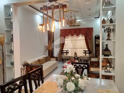 10 MARLA BEAUTIFUL HOUSE AVAILABLE FOR SALE IN NASHEMAN IQBAL PHASE 2 . . HOT LOCATION