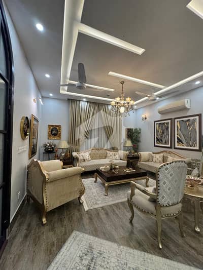 OWNER BUILT 1-KANAL ELEGANT BUT LIGHTLY USED ONLY ONE YEAR FULLY MAINTAINED SUPER HOT LOCATED BUNGALOW IS AVAILABLE IN THE T BLOCK OF DHA PHASE 7 LAHORE